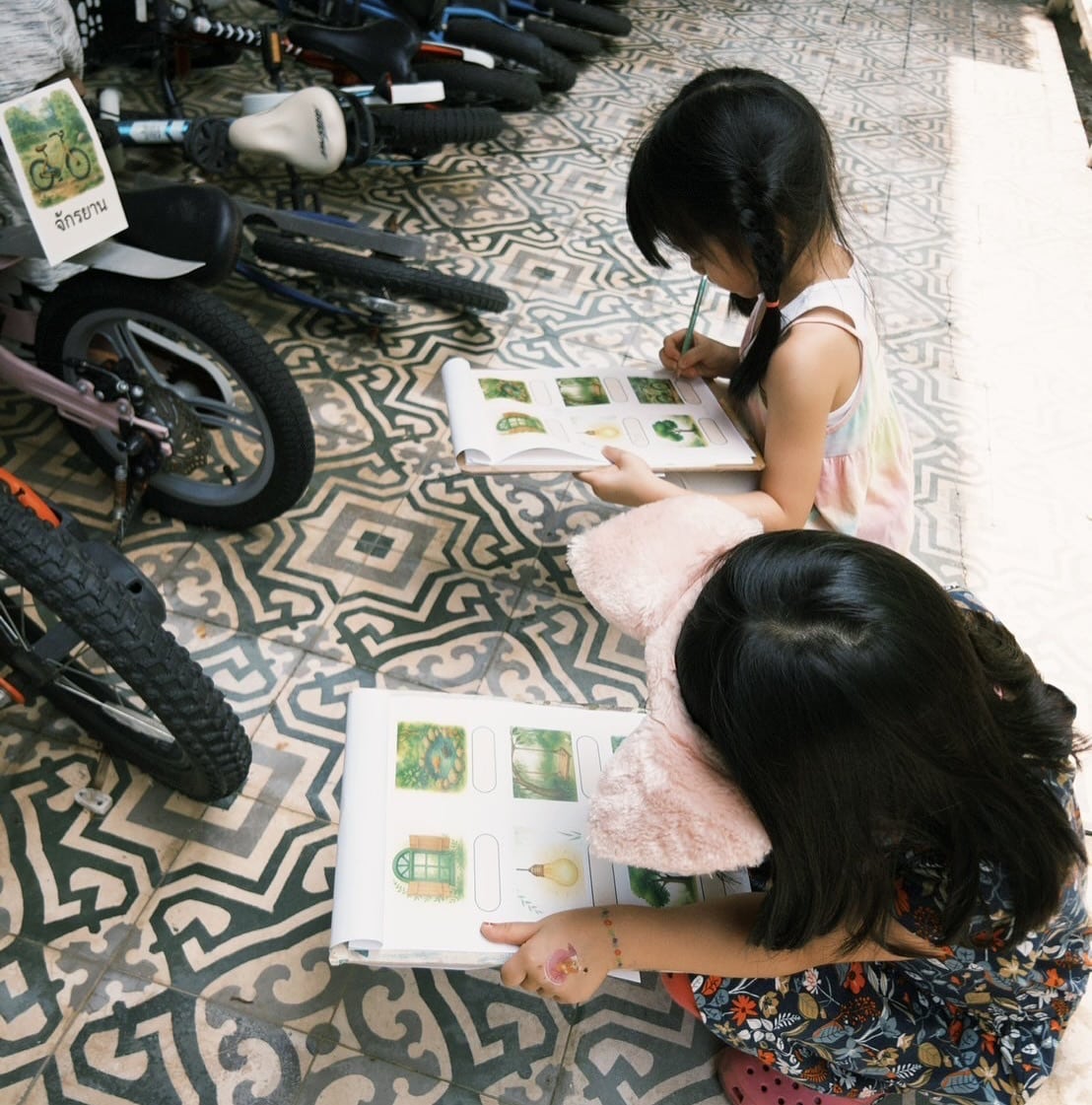 Children singing in English and Thai during a playgroup at Firefly Forest School’s alternative school in Thailand.