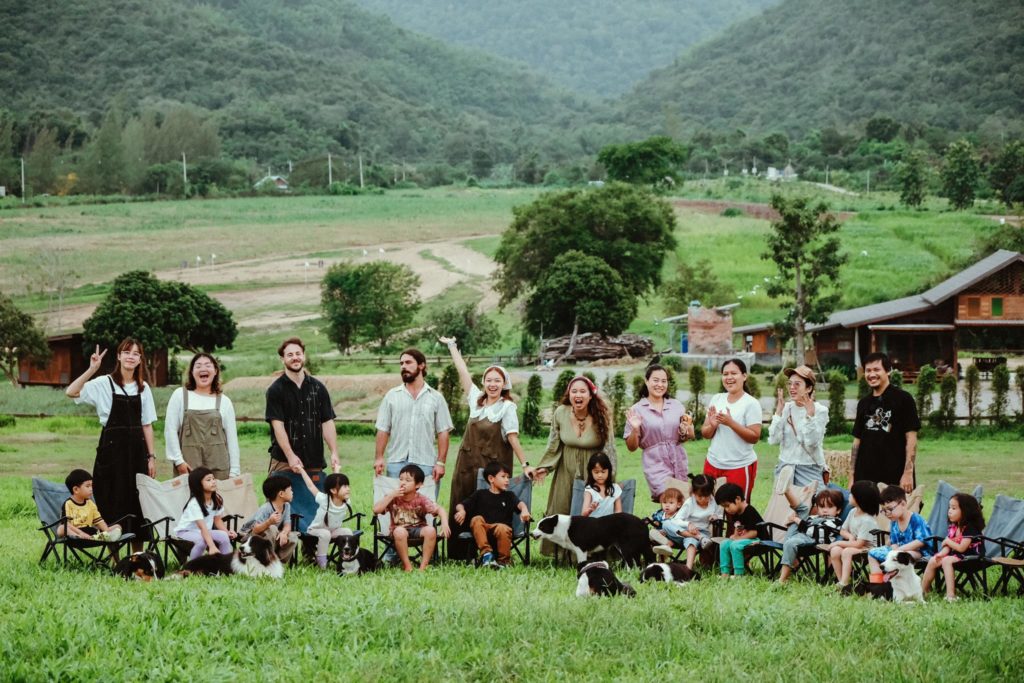 A group of kids on a nature walk with trained staff at Firefly Forest School in Bangkok.

