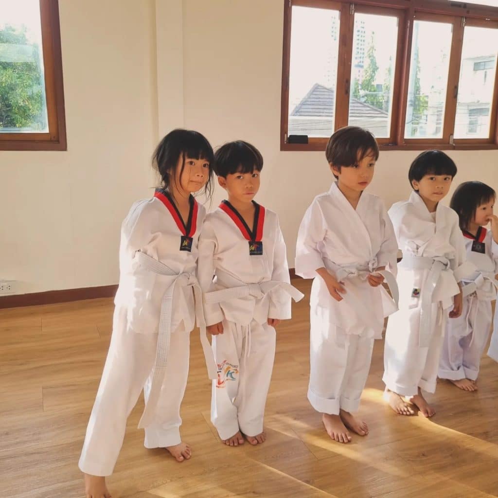 Children practicing karate moves in the school during a class at Firefly Forest School in Bangkok.3