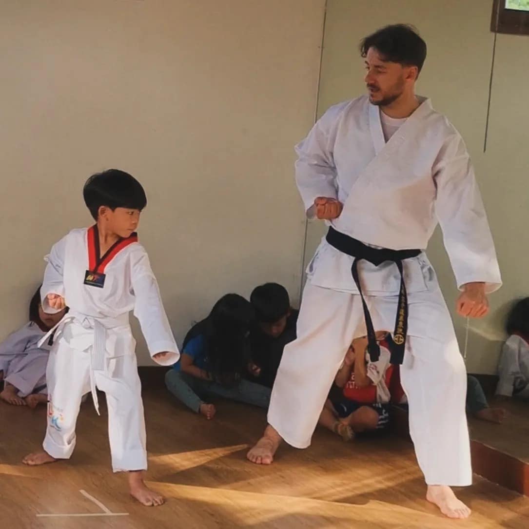 Children practicing karate moves in the school during a class at Firefly Forest School in Bangkok.3