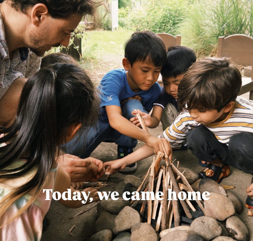A group of kids on a scavenger hunt during a forest school activity at Firefly Forest School in Bangkok.