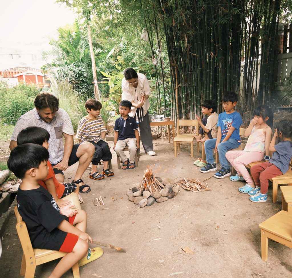 Children exploring the Secret Garden during a playgroup at Firefly Forest School in Bangkok.

