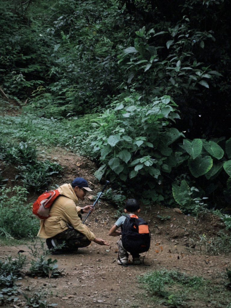 Children exploring a cave during a summer camp at Kaeng Krachan National Park with Firefly Forest School.

