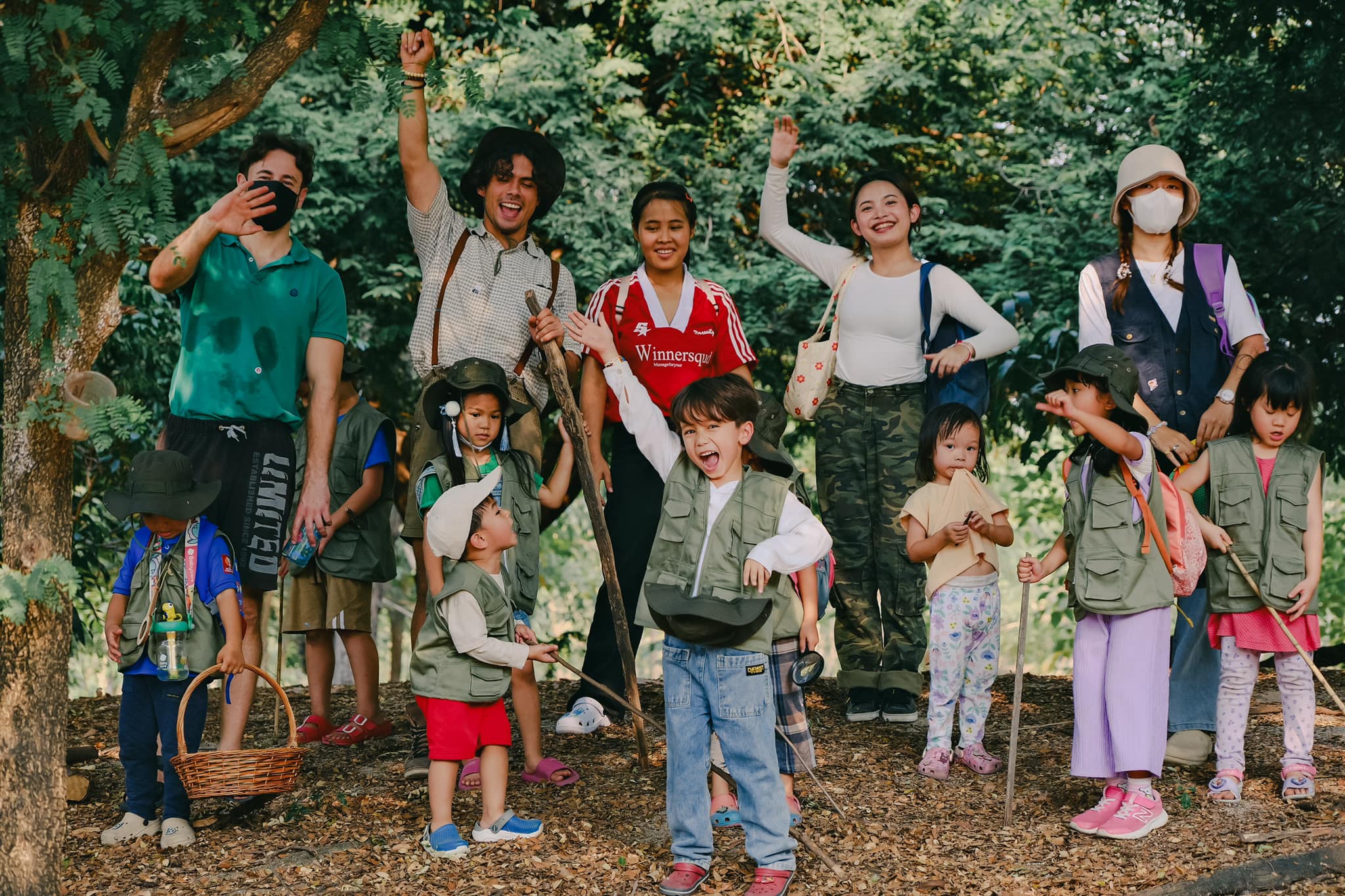 A family enjoying a campfire night at Firefly Forest School’s family event in Bangkok.