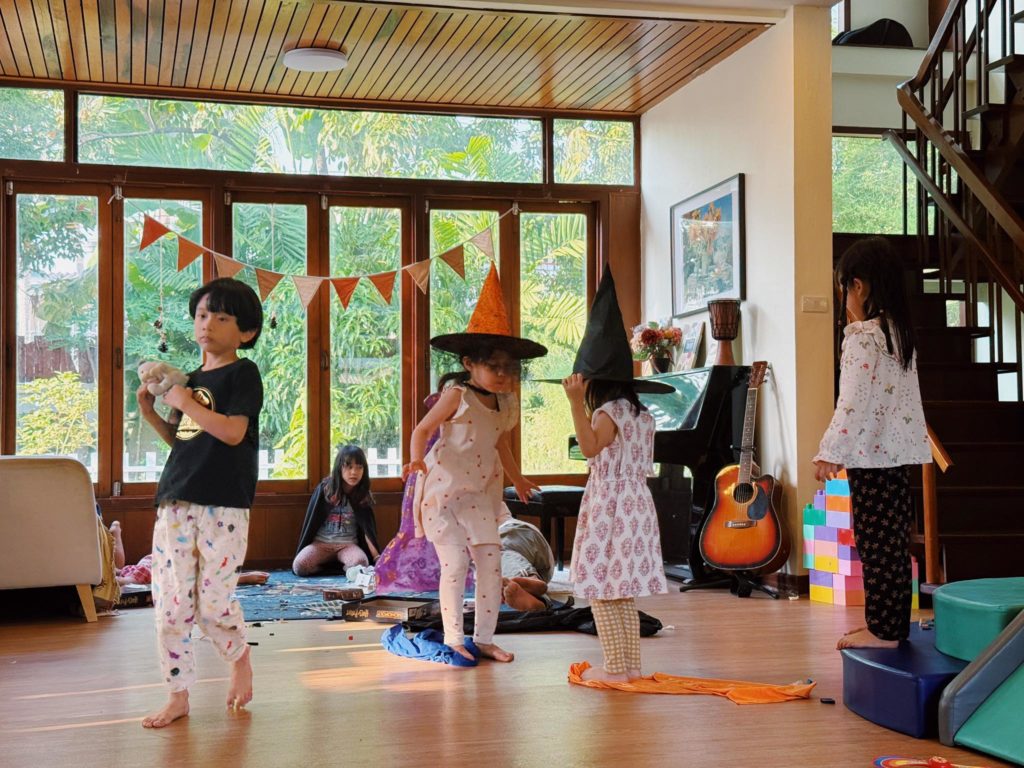 Preschoolers exploring sensory play in the Secret Garden at Firefly Forest School in Bangkok

