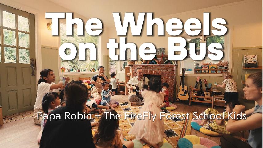 FireFly Forest School children singing and moving during The Wheels on the Bus song